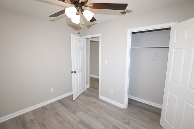 unfurnished bedroom with a closet, ceiling fan, and light wood-type flooring