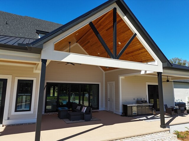 back of house featuring area for grilling and a patio