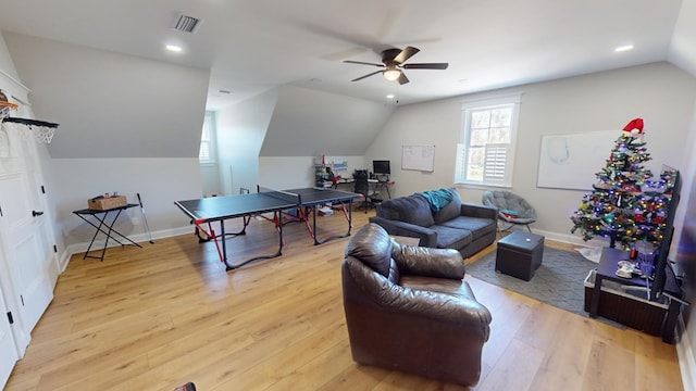 game room with vaulted ceiling, ceiling fan, and light hardwood / wood-style floors