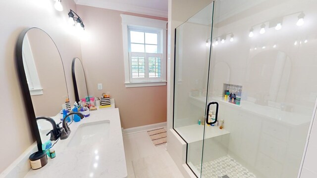 bathroom with vanity and a shower with door