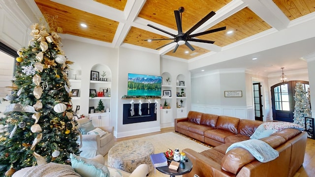 living room featuring coffered ceiling, built in shelves, and wooden ceiling