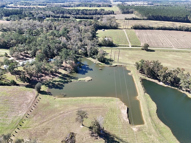 drone / aerial view featuring a water view and a rural view