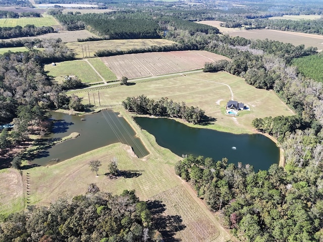 bird's eye view featuring a water view and a rural view