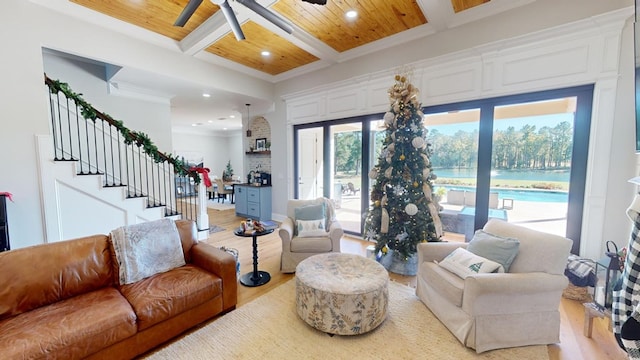 living room featuring wood ceiling, coffered ceiling, light hardwood / wood-style floors, and crown molding