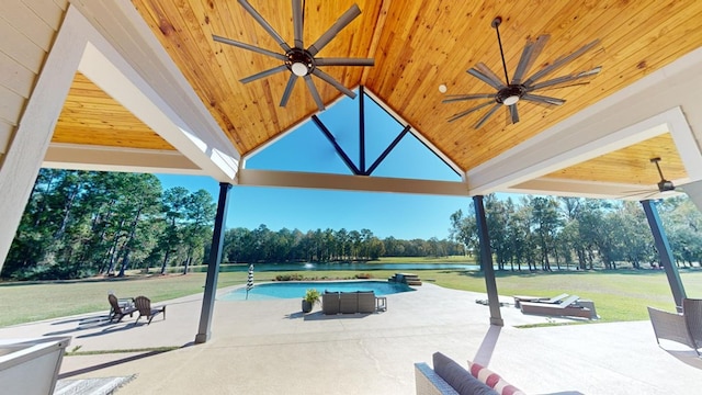 exterior space with a water view, a swimming pool, a yard, and a patio area