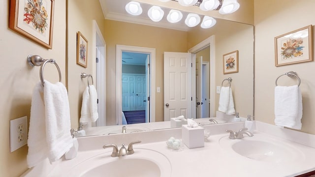 full bath featuring double vanity and crown molding