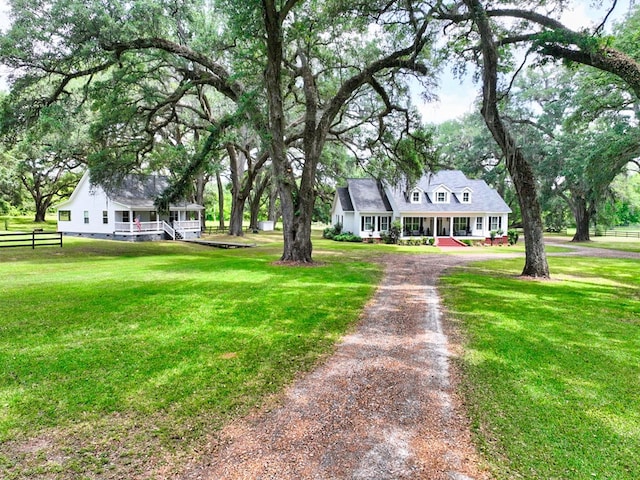view of front of property featuring covered porch and driveway