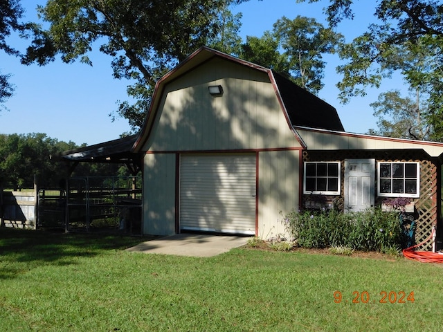 garage with a yard