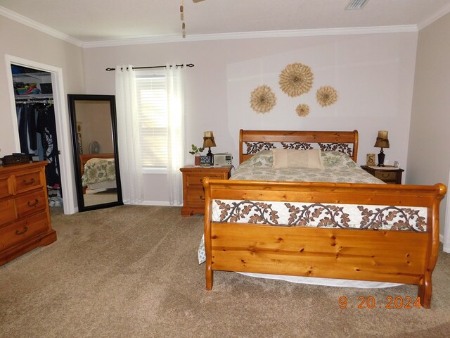 carpeted bedroom featuring ornamental molding