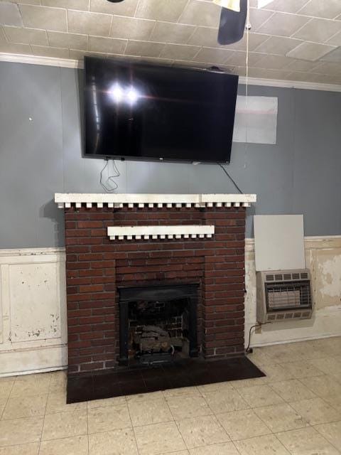 room details with crown molding, a brick fireplace, and heating unit