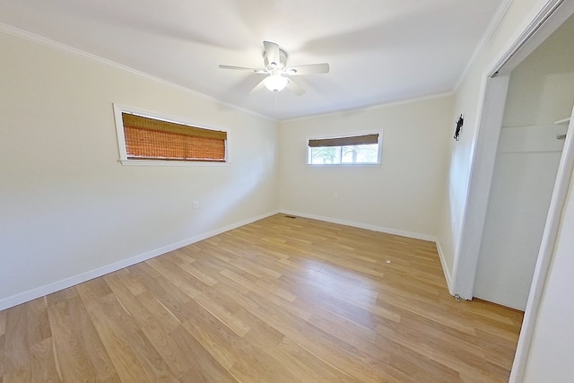 unfurnished bedroom with ornamental molding, ceiling fan, light hardwood / wood-style floors, and a closet