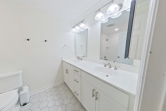 bathroom with crown molding, vanity, a shower, tile patterned floors, and toilet