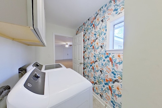 laundry room featuring cabinets and washing machine and dryer