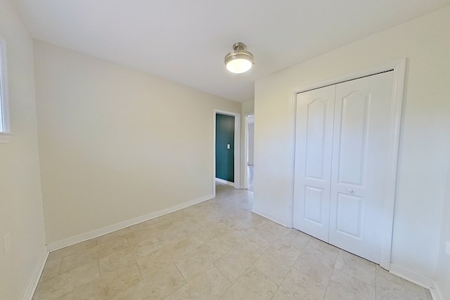 unfurnished bedroom with a closet