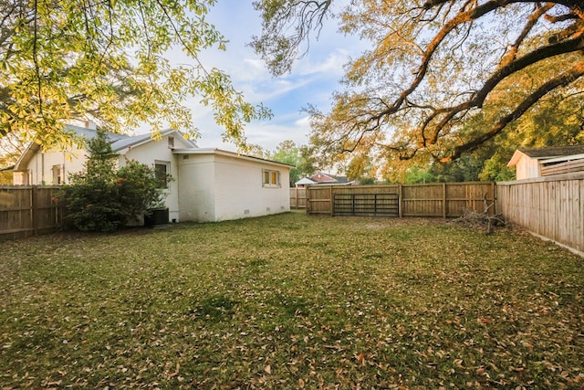 view of yard with a fenced backyard