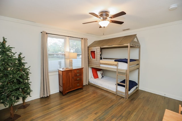bedroom with baseboards, visible vents, a ceiling fan, and hardwood / wood-style flooring