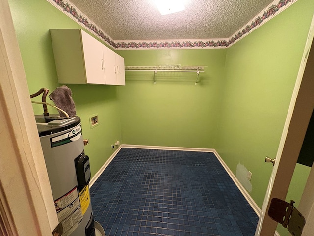102 Spruce Pine Dr, Thomasville, GA 31757 - washroom featuring hookup for a washing machine, a textured ceiling, cabinet space, and electric water heater
