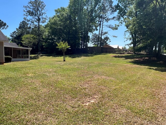 102 Spruce Pine Dr, Thomasville, GA 31757 - view of yard featuring a sunroom