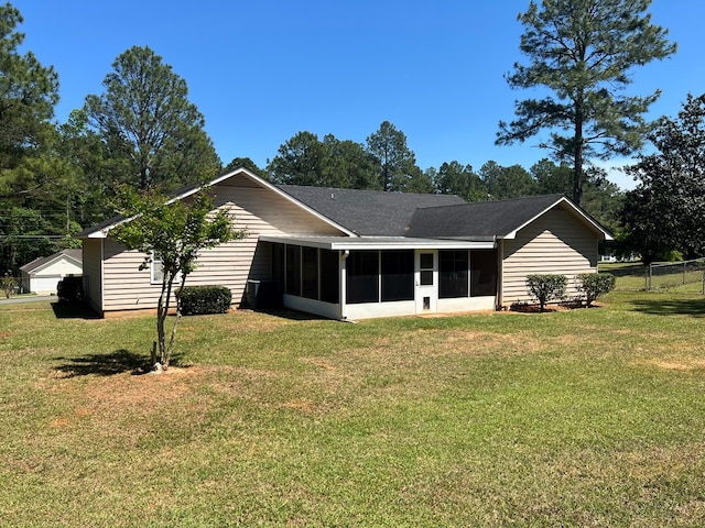 102 Spruce Pine Dr, Thomasville, GA 31757 - rear view of house with a sunroom and roof with shingles