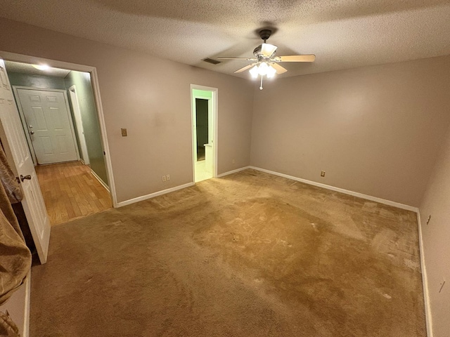 102 Spruce Pine Dr, Thomasville, GA 31757 - unfurnished room with light carpet, ceiling fan, and a textured ceiling