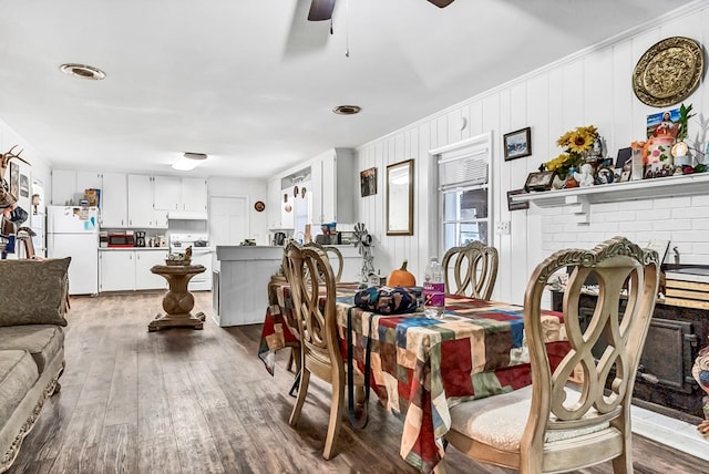 dining room featuring hardwood / wood-style floors and ceiling fan