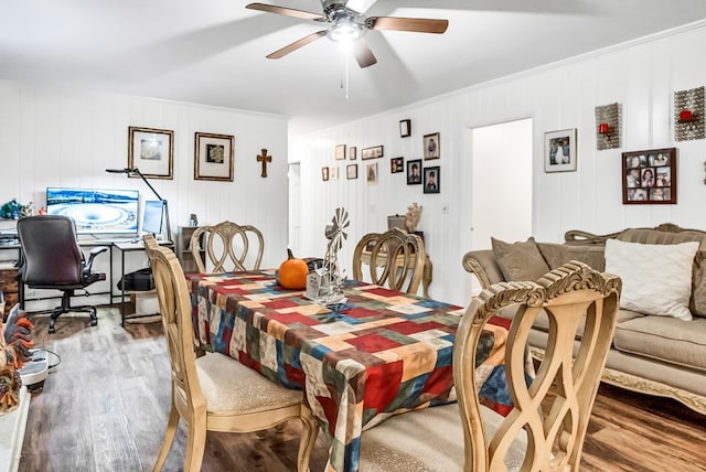 dining area with crown molding, hardwood / wood-style floors, and ceiling fan