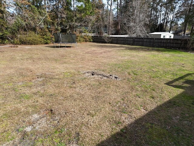 view of yard featuring a trampoline