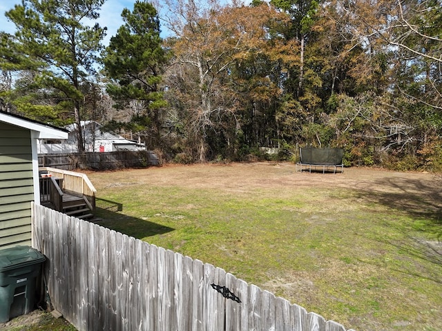 view of yard with a trampoline