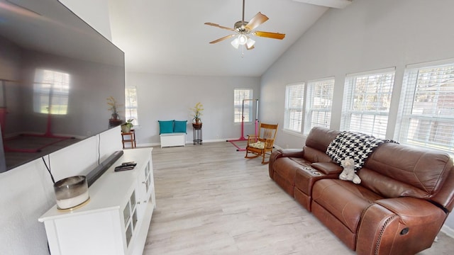 living room with light hardwood / wood-style flooring, high vaulted ceiling, and ceiling fan