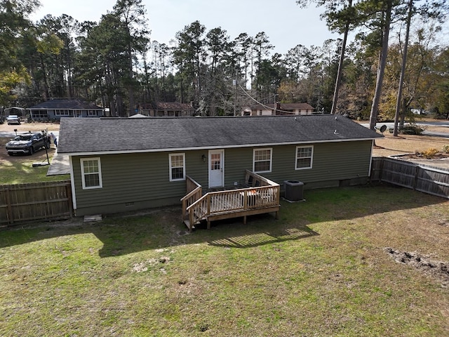 back of house with a wooden deck, a yard, and central AC