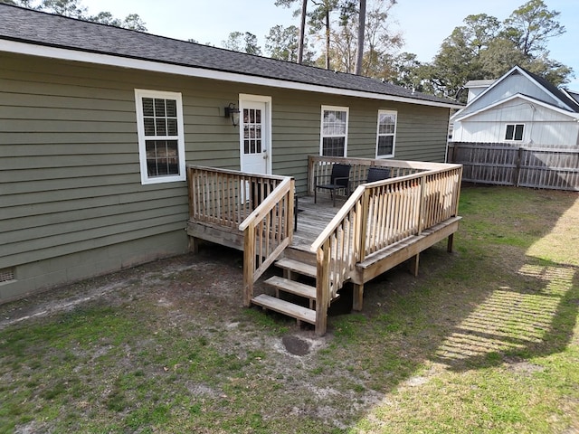 back of house featuring a yard and a deck