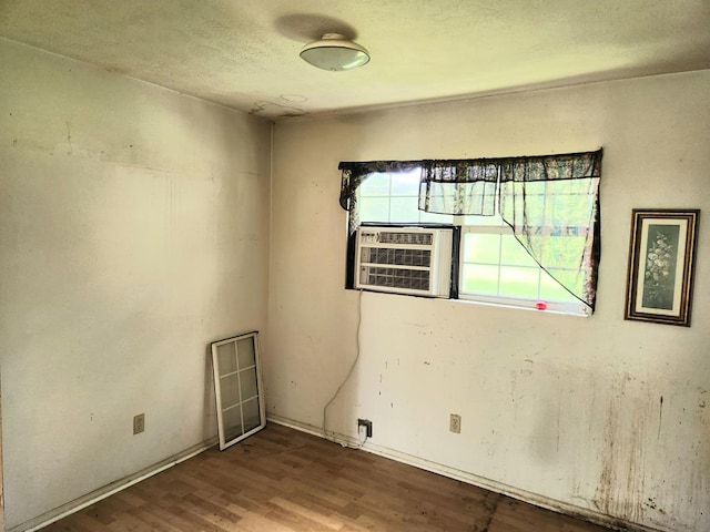 3812 Ponder Rd, Thomasville, GA 31757 - unfurnished room with wood finished floors and a textured ceiling