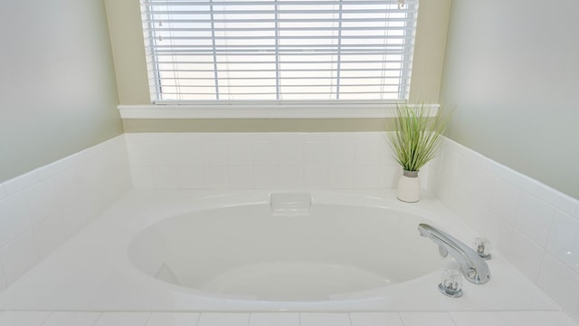 bathroom with tiled bath