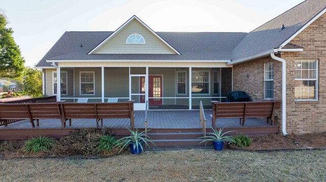 view of front of property featuring a wooden deck