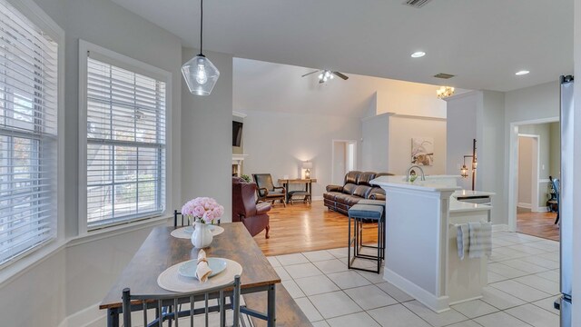 living room with light tile patterned flooring and ceiling fan