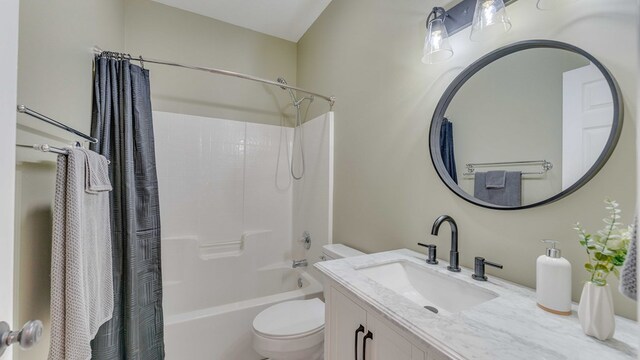 full bathroom with vanity, shower / bath combo with shower curtain, and toilet