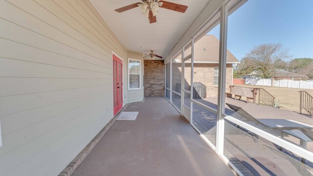 exterior space with ceiling fan