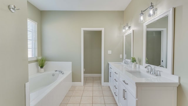 bathroom with vanity, a relaxing tiled tub, and tile patterned floors