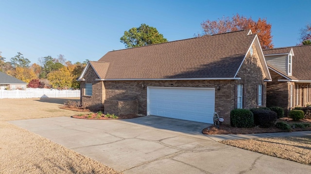 view of side of property with a garage