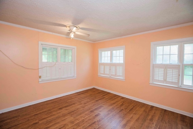 unfurnished room featuring a textured ceiling, baseboards, wood finished floors, and a ceiling fan