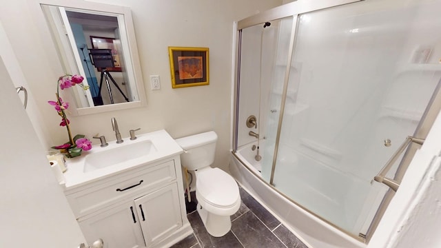 bathroom featuring shower / bath combination with glass door, vanity, and toilet