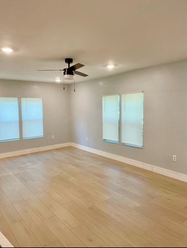 460 SW 2nd St, Cairo, GA 39828 - spare room featuring light wood-style floors, baseboards, a ceiling fan, and recessed lighting