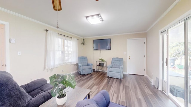 611 Patterson Still Rd, Thomasville, GA 31792 - living room featuring light wood-style floors, crown molding, and baseboards