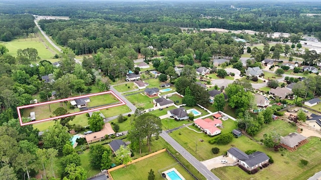 611 Patterson Still Rd, Thomasville, GA 31792 - aerial view of property and surrounding area with property parcel outlined, a heavily wooded area, and nearby suburban area