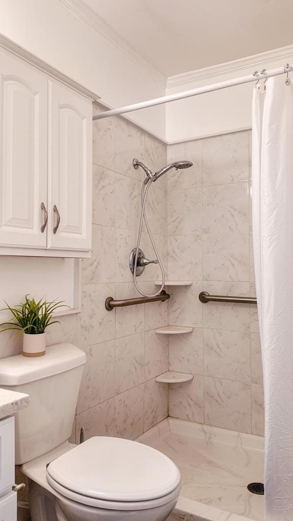 611 Patterson Still Rd, Thomasville, GA 31792 - bathroom with toilet, a stall shower, vanity, and crown molding