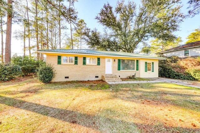 ranch-style home with a front yard