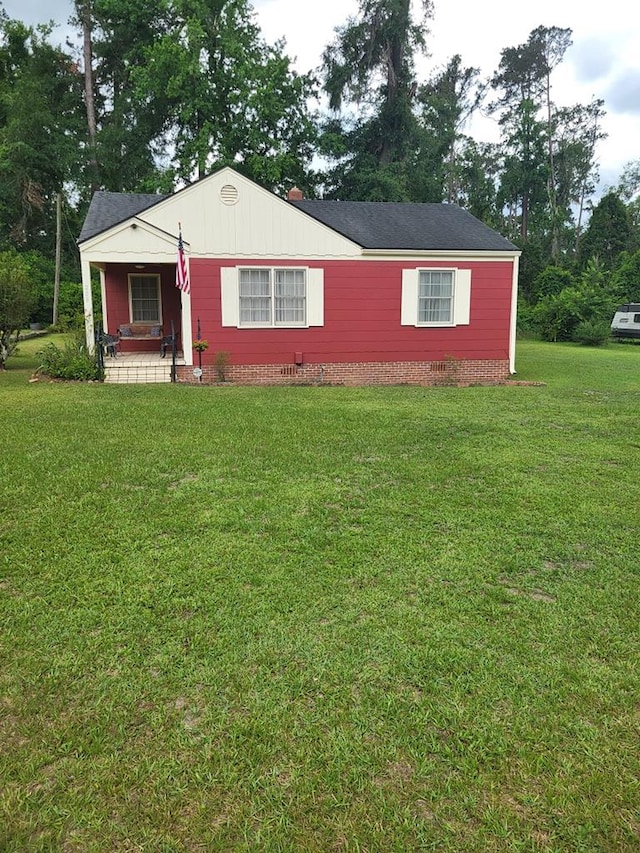 208 Pine St, Quitman, GA 31643 - view of front of property featuring a front yard and a porch