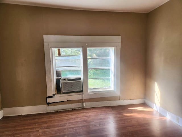 unfurnished room with hardwood / wood-style flooring and cooling unit