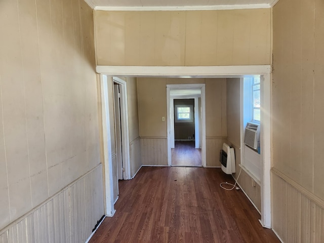 hall featuring heating unit, cooling unit, and dark hardwood / wood-style flooring