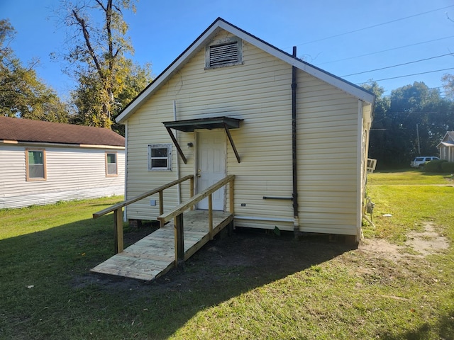 back of house with a yard